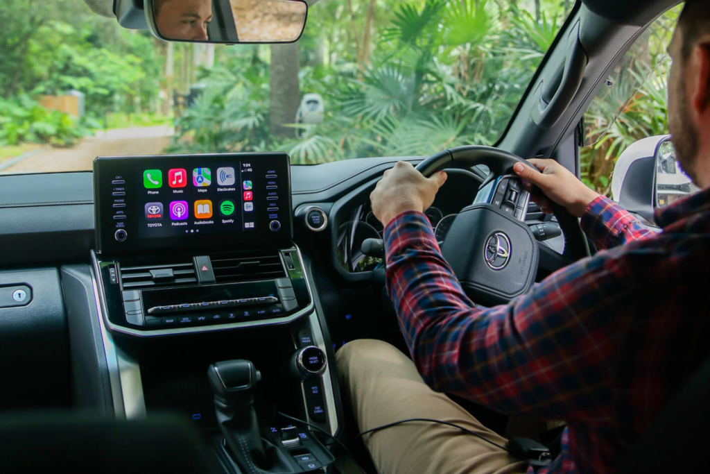 Driver using the Elecbrakes App with Apple CarPlay