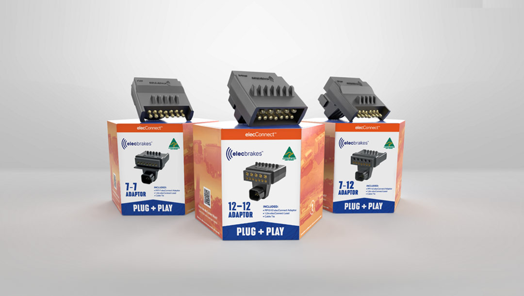 Person holding the Elecbrakes VM1 brake controller next to its packaging, showcasing the product and box design.