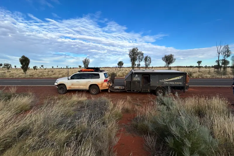 A car and caravan pulled over on the highway